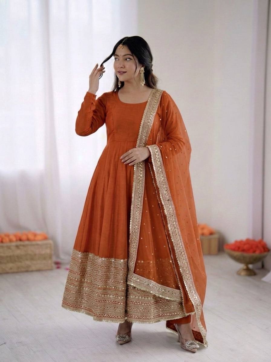 Beautiful Party Wear Orange Roman Silk Anarkali Gown With Dupatta For Women