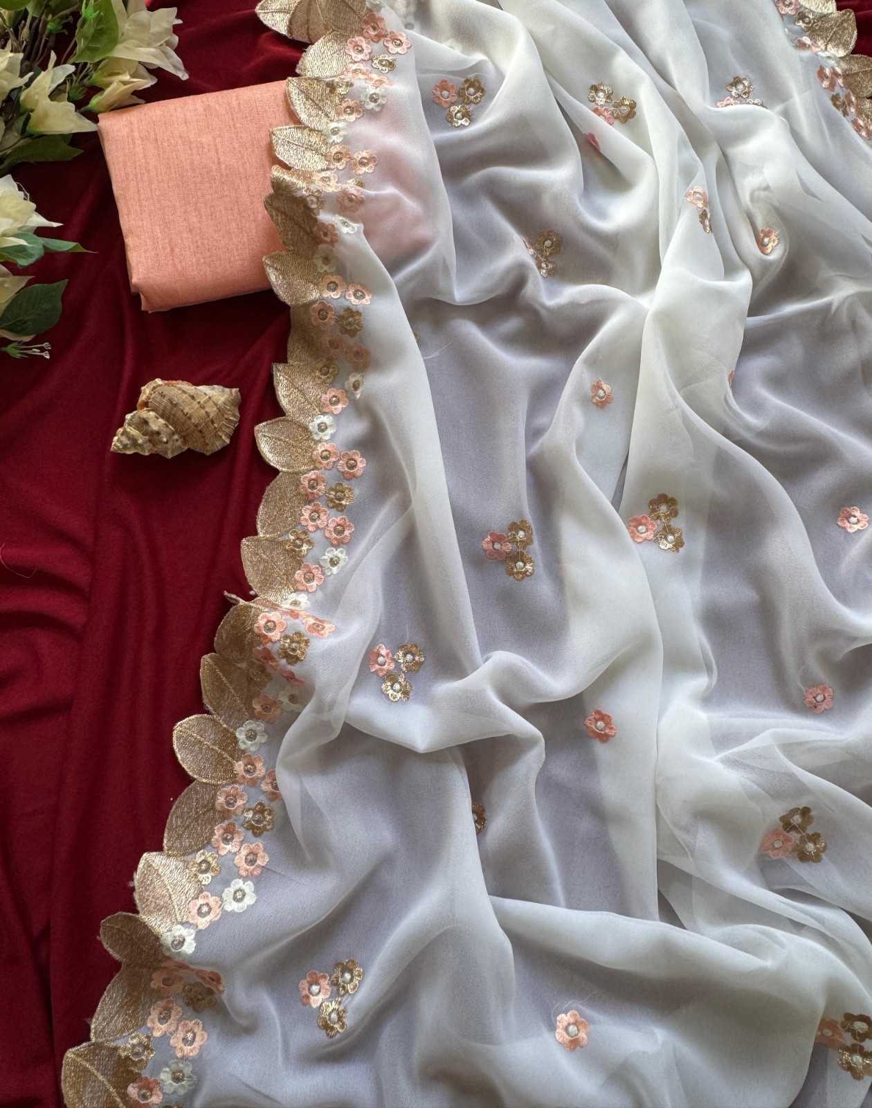 Elegant White Chiffon Georgette Saree with Peach & Gold Floral Embroidery.