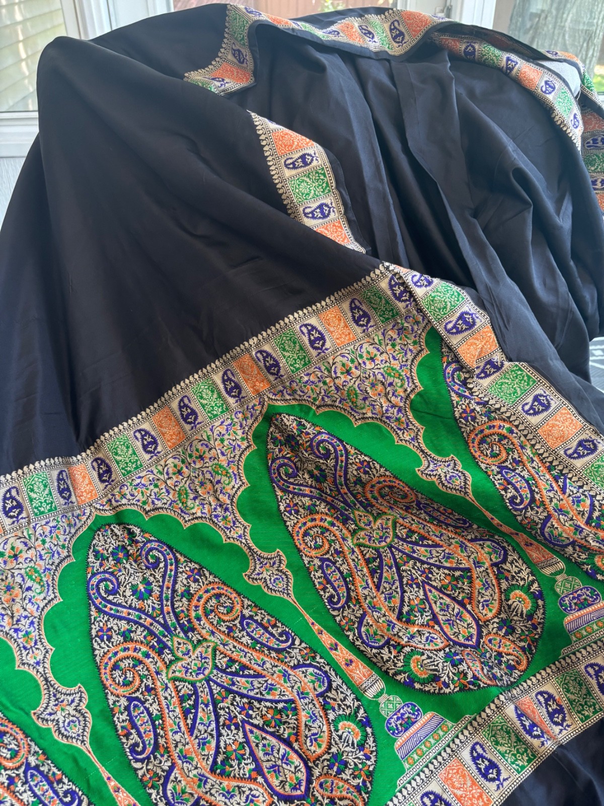 Black silk saree with brocade green pallu with fall and pico.